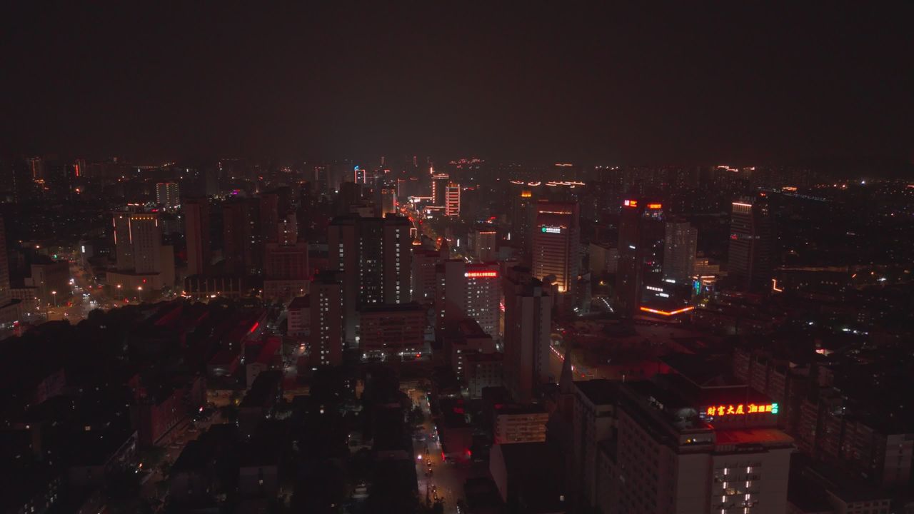 Aerial View Of City Skyline At Night With Neon Lights — Pexels video still by Usman AbdulrasheedGambo